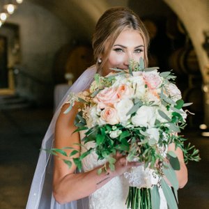 Offering Full Service Wedding Planning allows us to help you create and design. We hand select all your vendors, including the floral vendor for this wine country wedding. This stunning bouquet of sage green, peach, and blush was created by Wine Country Flowers. The bride was awaiting in the barrel room at Viansa Sonoma, ready to walk down the aisle to her happily ever after. Photo credit: Evonne and Darren Photography