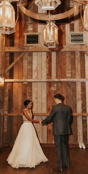 bride and groom enjoy their first dance in the lodge at waterfall lodge, california. White indian wedding lehenga