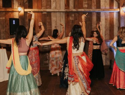 Indian wedding traditions. the friends and family dance a traditional bollywood dance at the wedding reception