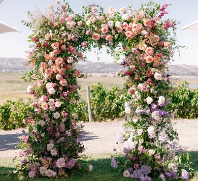 The perfect full and lush floral wedding arch for a ceremony at viansa sonoma, california. 
