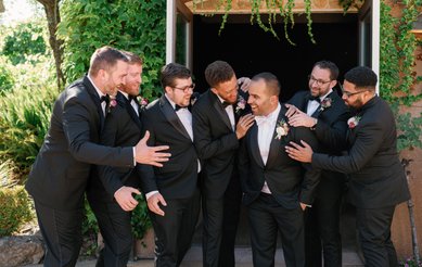 groom and groomsmen goofing around before the wedding ceremony at Viansa Winery