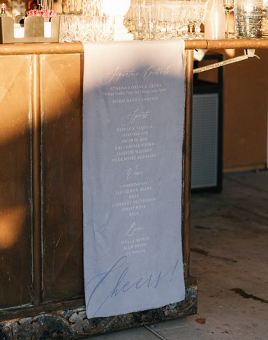 hanging fabric bar sign for signature drinks, wine list and beer list. Winery wedding bar sign ideas