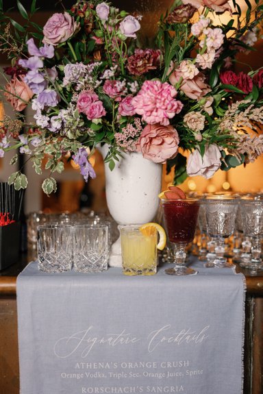 Signature cocktails for winery wedding at Viansa in Sonoma, CA. flower arrangement for the bar